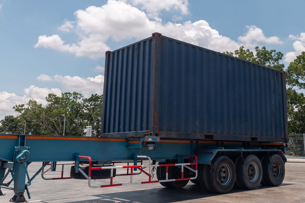Trucking, Import, Export, Logistics, Industry with beautiful sky and Car Park background.