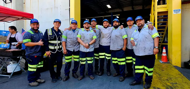 Group of employees posing together at the warehouse