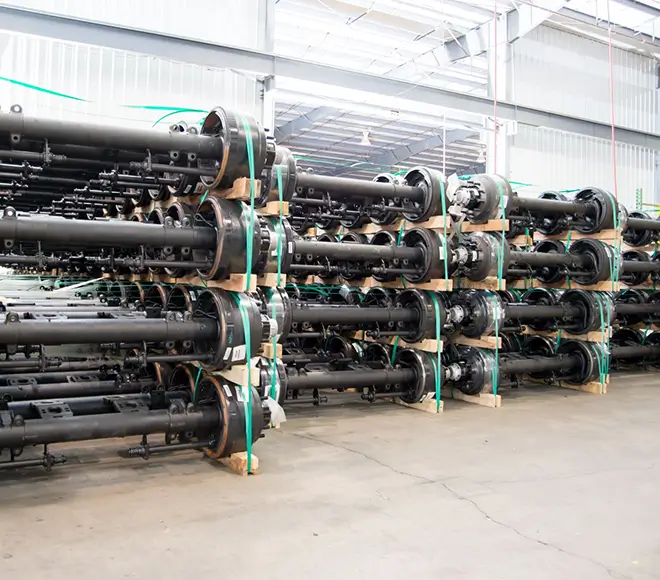 Stacked chassis axles in warehouse storage